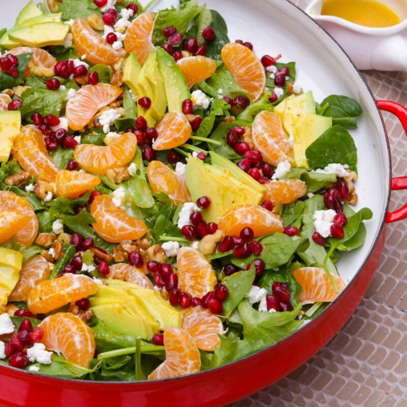 Mandarin orange salad in a shallow serving bowl on table.