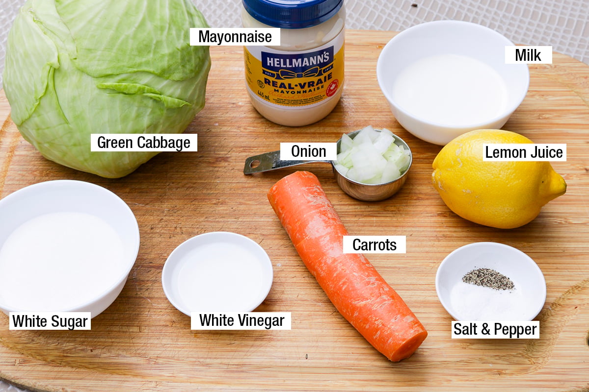 Green cabbage, mayonnaise, milk, chopped onions, lemon juice, carrots, salt, pepper, white vinegar, white sugar.