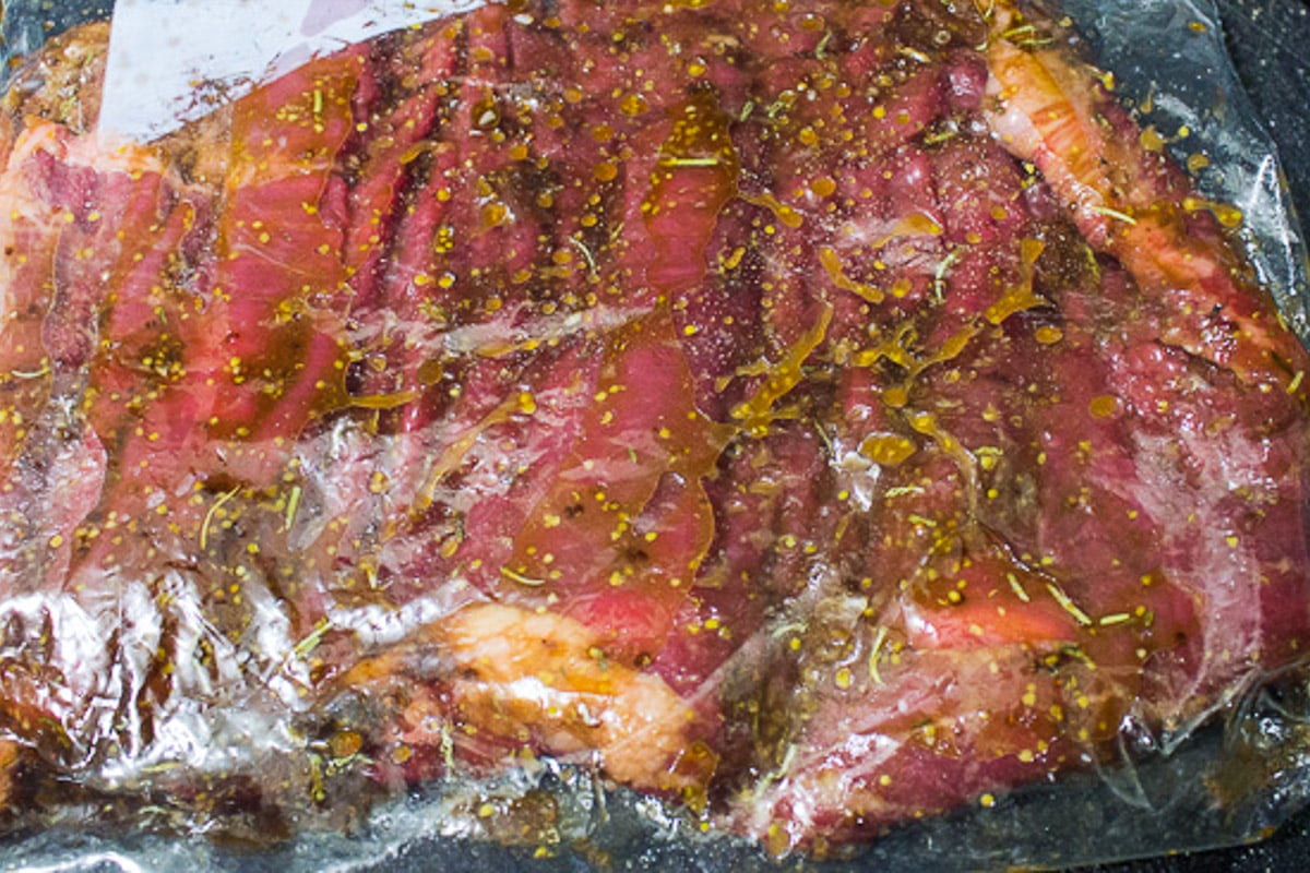 Flank steak marinating in zipper locked bag.