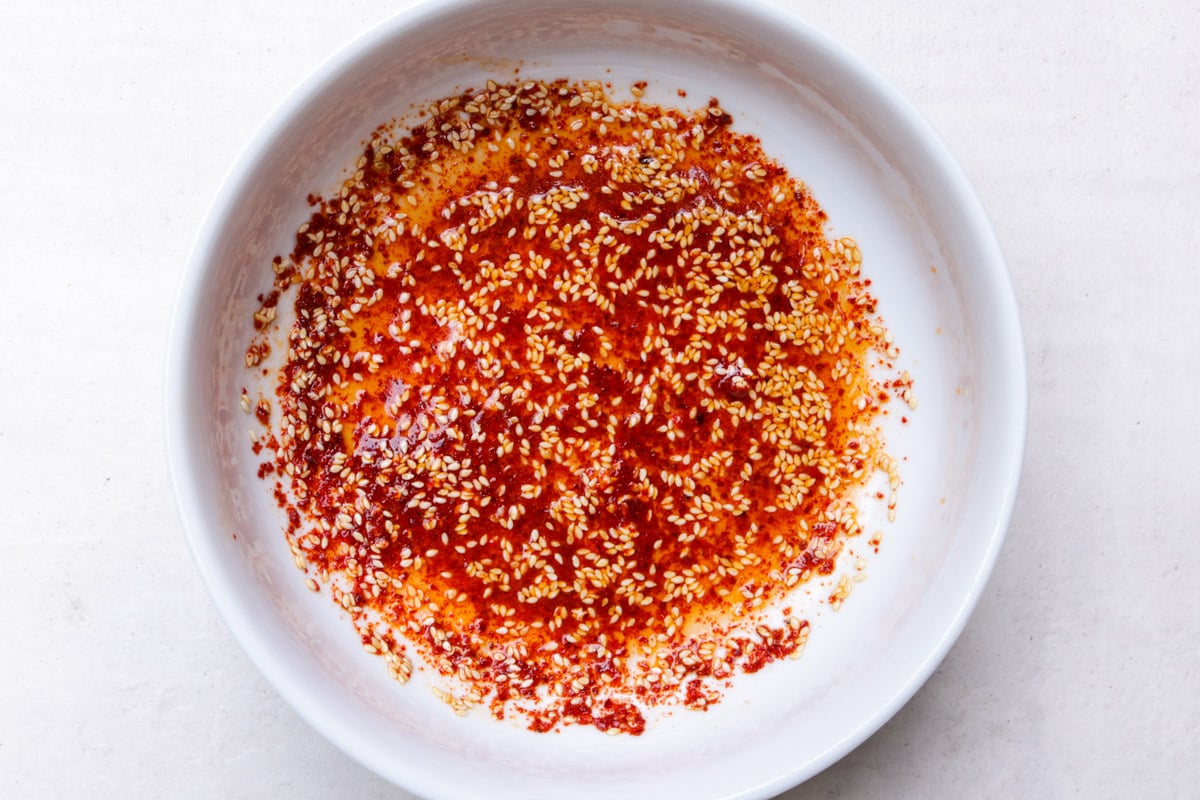 Dressing ingredients mixed in a large white bowl.