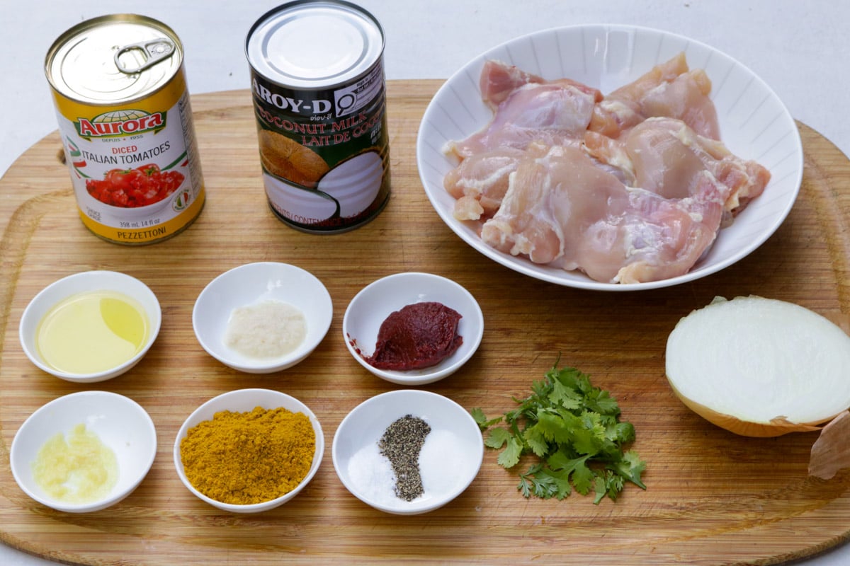 Boneless skinless chicken, coconut milk, diced tomatoes, ginger, garlic, onion, salt-pepper-sugar, vegetable oil, curry powder, tomato paste, cilantro.