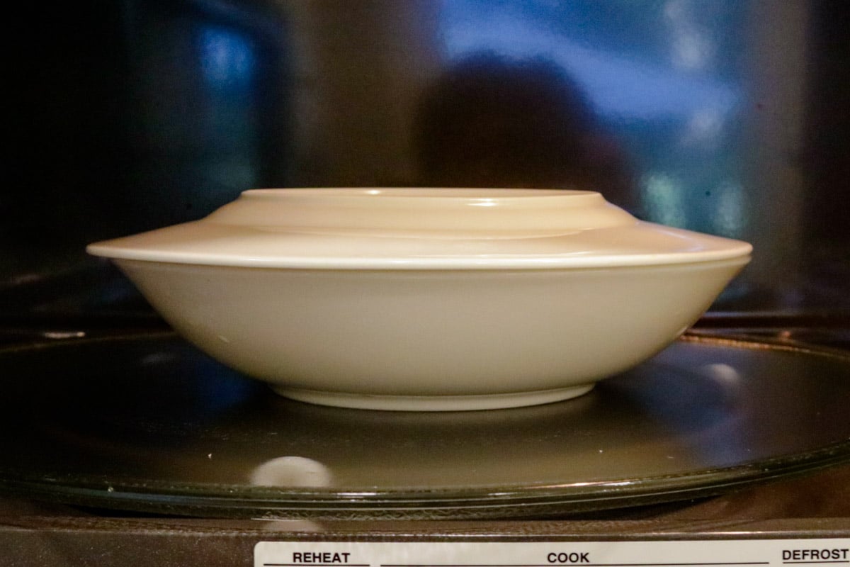 Covered dish in microwave.