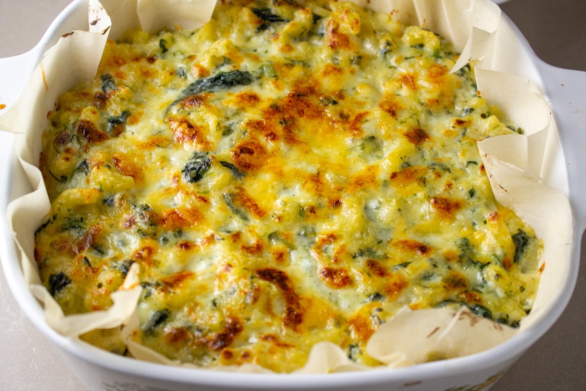 Baked spinach mac and cheese casserole.