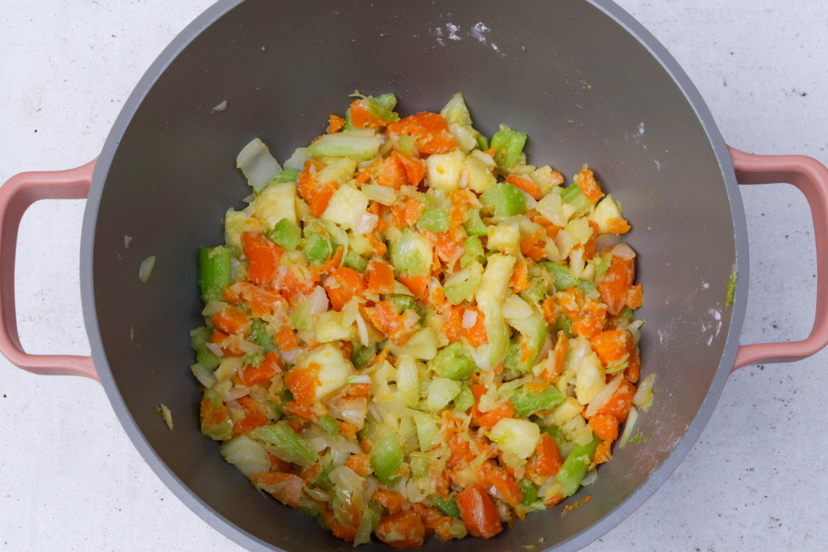 Sauteed vegetables in a pot.